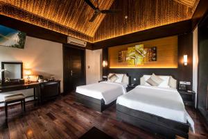 Ein Bett oder Betten in einem Zimmer der Unterkunft Hon Tam Resort