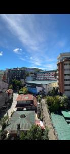 an overhead view of a city with buildings and trees at Studio Tower by KR in Baguio