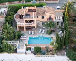 an aerial view of a house with a swimming pool at Luxusvilla - Villa in Denia in Denia
