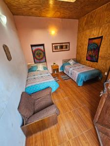Postel nebo postele na pokoji v ubytování Hostal Likancabur