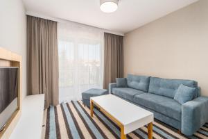 Televízia a/alebo spoločenská miestnosť v ubytovaní Perfect Holiday Apartments Bel Mare by Noclegi Renters