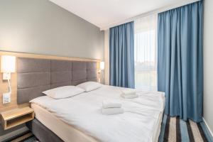 Posteľ alebo postele v izbe v ubytovaní Perfect Holiday Apartments Bel Mare by Noclegi Renters
