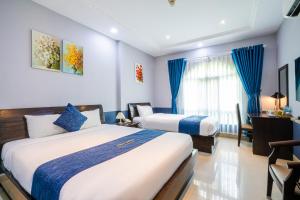 Postel nebo postele na pokoji v ubytování La Serena Hotel & Apartment