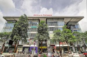 a building with a sign on the front of it at Hotel Unicorn, Surat in Surat