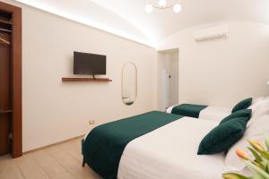Postel nebo postele na pokoji v ubytování Charm&Bella GuestHouse