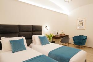 Postel nebo postele na pokoji v ubytování Charm&Bella GuestHouse