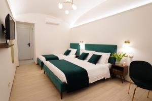 Postel nebo postele na pokoji v ubytování Charm&Bella GuestHouse