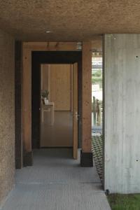 an open door to a hallway in a building at Hotel Amiuka in O Pedrouzo