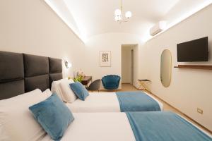 Postel nebo postele na pokoji v ubytování Charm&Bella GuestHouse