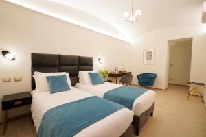 Postel nebo postele na pokoji v ubytování Charm&Bella GuestHouse