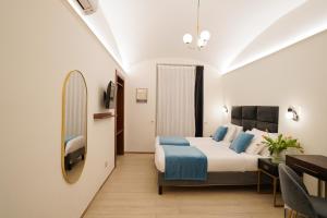 TV a/nebo společenská místnost v ubytování Charm&Bella GuestHouse