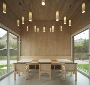 a conference room with tables and chairs and windows at Hotel Amiuka in O Pedrouzo