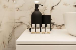 a bottle of soap sitting on a counter in a bathroom at Esclusivo appartamento con 2 camere da letto in Milan