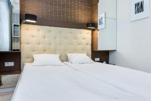 Łóżko lub łóżka w pokoju w obiekcie Elite Apartments Rezydencja Marina