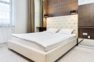 Łóżko lub łóżka w pokoju w obiekcie Elite Apartments Rezydencja Marina