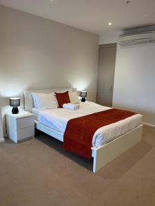 Ένα ή περισσότερα κρεβάτια σε δωμάτιο στο Tasha's Apartments on Morphett