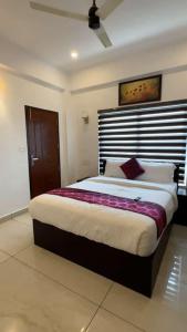 Ένα ή περισσότερα κρεβάτια σε δωμάτιο στο Himasailam Resort