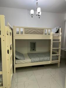 a couple of bunk beds in a room at Homecation in Dubai