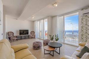 a living room with a view of the ocean at Tagora Breeze in Adeje