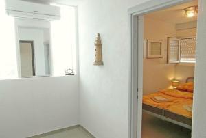 Postel nebo postele na pokoji v ubytování Vis Mirja Apartment 2
