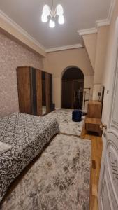 a large bedroom with a bed and a ceiling at Kristal Sumqayıt in Sumqayıt