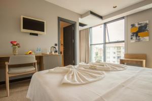 Postel nebo postele na pokoji v ubytování SHERLOCK HOMES HOTELS