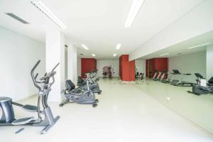 a gym with cardio equipment in a large room at Vista Mar Concórdia by Rentallido in Funchal
