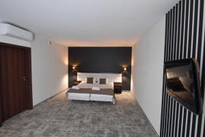 Posteľ alebo postele v izbe v ubytovaní Hotel Focus Centrum Konferencyjne