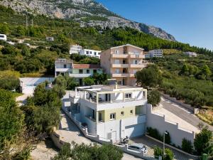 an aerial view of a house with a mountain at Grande Villa Horizon in Makarska