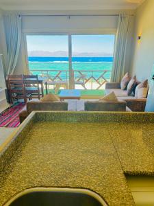 a large living room with a view of the ocean at Moon house n.30 in Dahab +13 photos