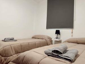 Postel nebo postele na pokoji v ubytování Apartamentos Maria
