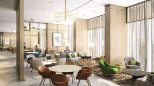 a rendering of a lobby with tables and chairs at Hilton Garden Inn Dubai Business Bay in Dubai