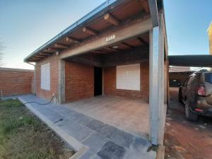 a garage with awning on top of a brick building at La Malargüina in Malargüe