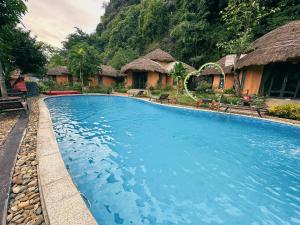 a swimming pool in front of a resort at Trang An Legend in Ninh Binh