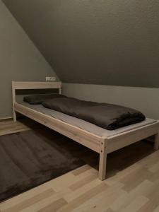 a white bed in a room with at 3 Room City Apartment 90m2 in Heilbronn