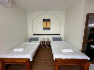 Ένα ή περισσότερα κρεβάτια σε δωμάτιο στο Chansi Beachresort