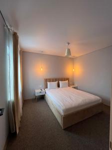 Postel nebo postele na pokoji v ubytování Imperial Hotel