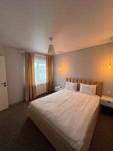 Postel nebo postele na pokoji v ubytování Imperial Hotel