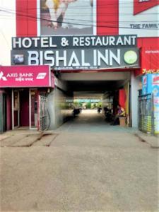 a sign for a hotel and restaurant british inn at Hotel Bishal Inn,Cuttack in Cuttack