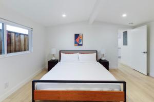 a white bedroom with a bed and a window at Cupertino 3br w patio backyard nr restaurants SFO-1636 in Cupertino