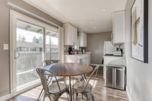 a kitchen with a table and chairs and a refrigerator at Mountain View 2br w pool patio nr Caltrain SFO-1640 in Mountain View