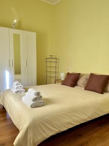 Postel nebo postele na pokoji v ubytování Napulè house - Napoli appartamento in centro