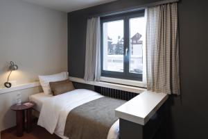 A bed or beds in a room at Hotel Bergidyll - Riders Haven