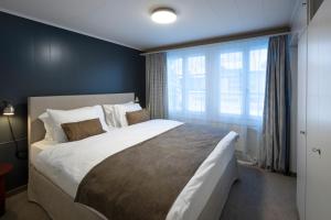 A bed or beds in a room at Hotel Bergidyll - Riders Haven
