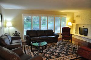 a living room with a couch and a coffee table at Forest Hill Bed and Breakfast in Kitchener