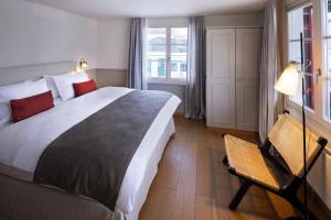A bed or beds in a room at Hotel Bergidyll - Riders Haven