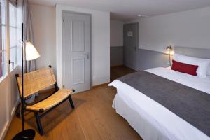A bed or beds in a room at Hotel Bergidyll - Riders Haven