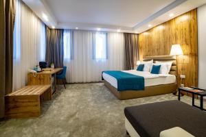Postel nebo postele na pokoji v ubytování MARK Hotel