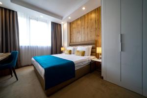 Postel nebo postele na pokoji v ubytování MARK Hotel