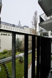 a balcony with a view of a building at Standard Apartment by Hi5-Horváth Mihály square in Budapest